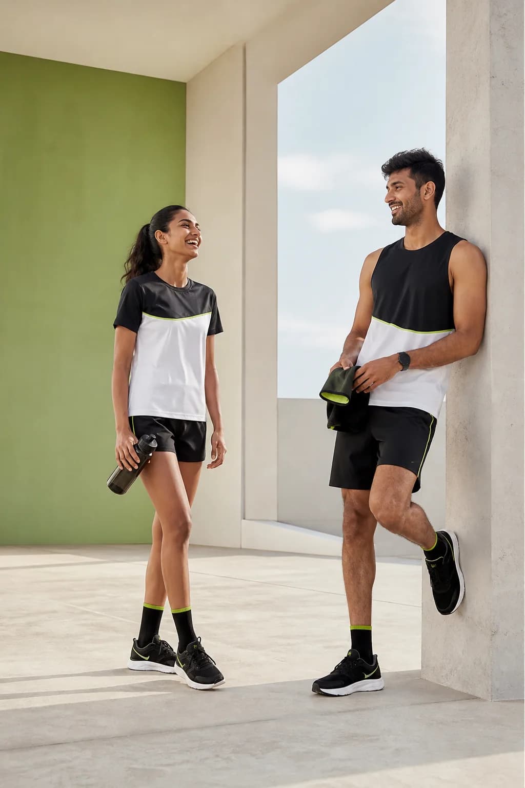 RUNZA athletes in coordinated black, white and lime training wear